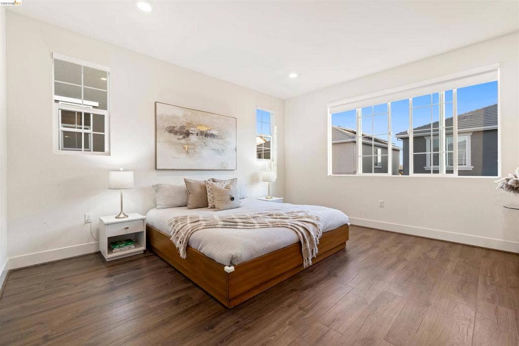 539 Gemstone Way, Oakley, CA 94561 Neutral interior featuring wood-finish flooring, recessed lighting, and large windows with muntin detailing