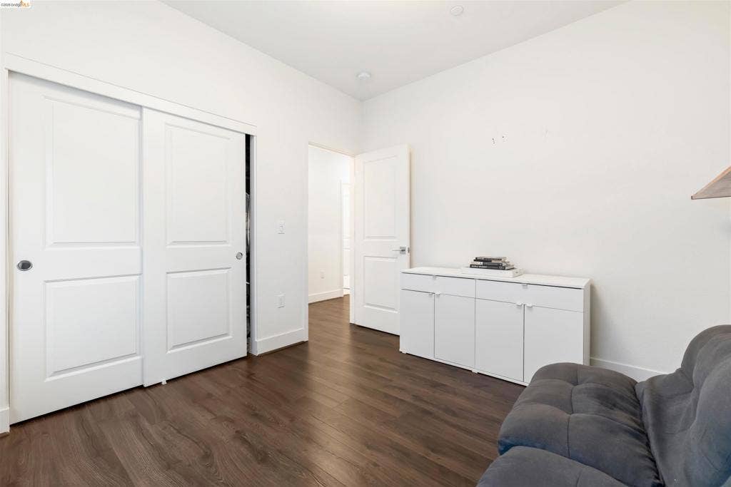 539 Gemstone Way, Oakley, CA 94561 Wood-finish flooring, white walls, and interior doors with two-panel detailing