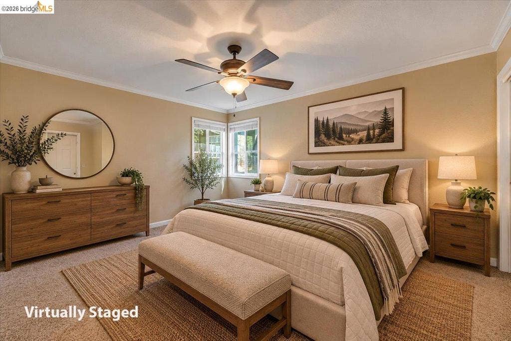 5827 Lookout Ct, CA 95233 Neutral wall color, crown molding, and central ceiling fan with integrated lighting
