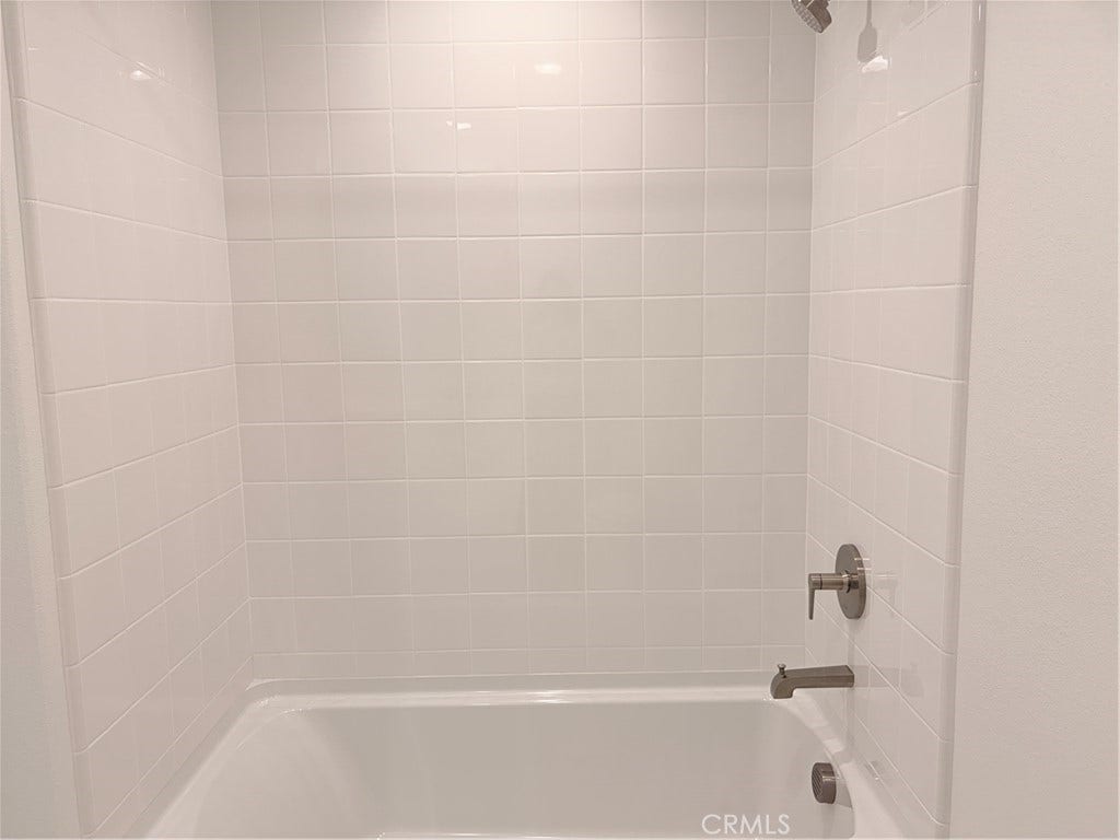 348 Plume Way, Montebello, CA 90640 Shower in the bathtub for the shared bathroom on the second floor