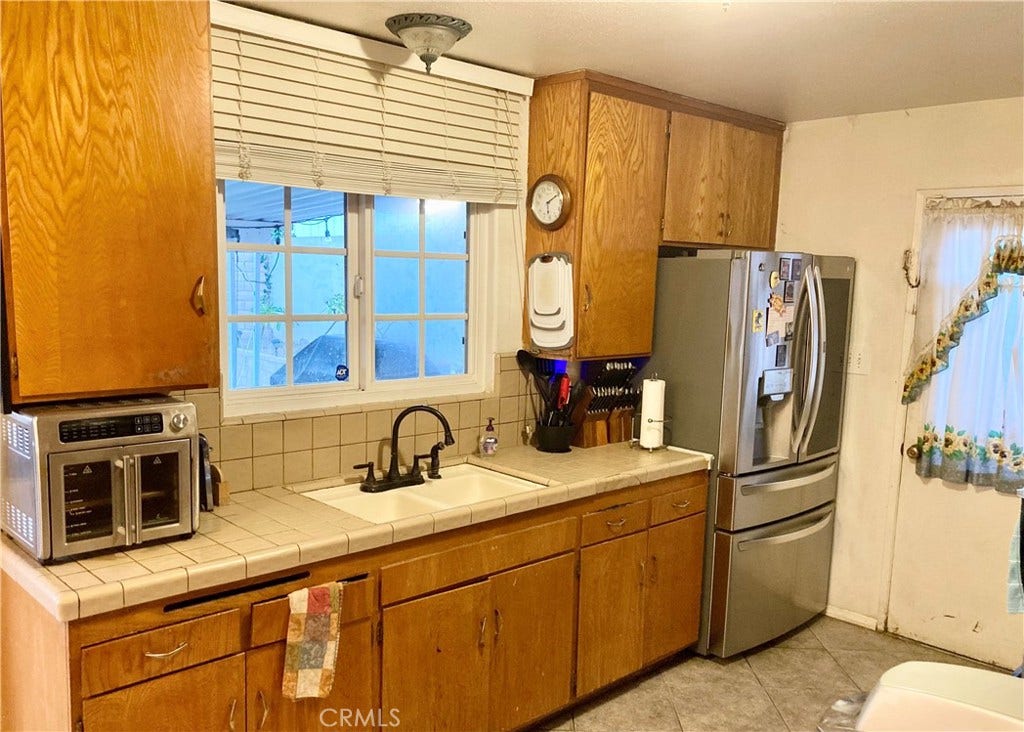 1273 Elsinor Avenue, Ventura, CA 93004 Kitchen sink view to patio & rear yard