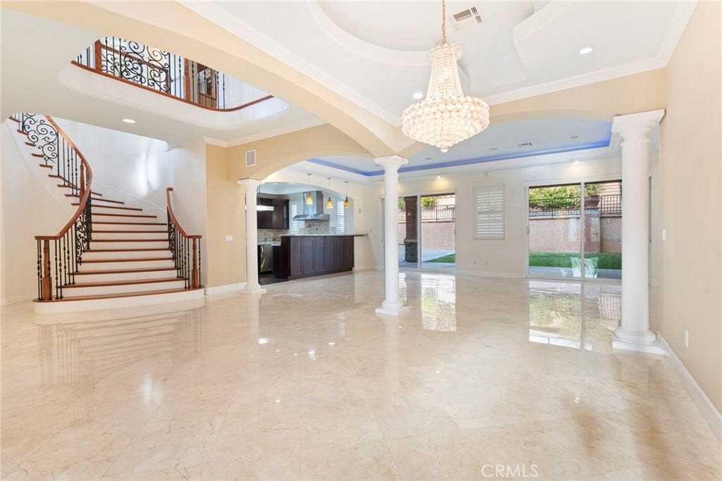 21819 E Chestnut Court, Walnut, CA 91789 Looking from formal dining room to the elegant oakwood staircase