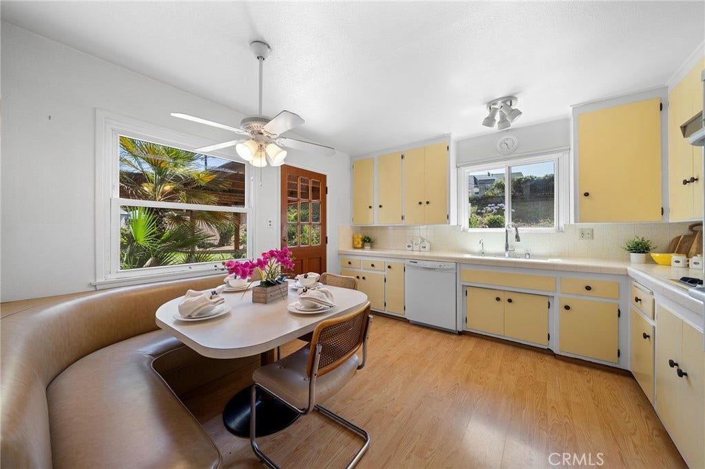 604 N Charter, Covina, CA 91724 Lovely kitchen with curved bench seating that has space for storage under the cushions. Table remains. Built in stove and oven. Kitchen sink overlooks the backyard. Side door leads to covered patio and the door to the garage which has the laundry.