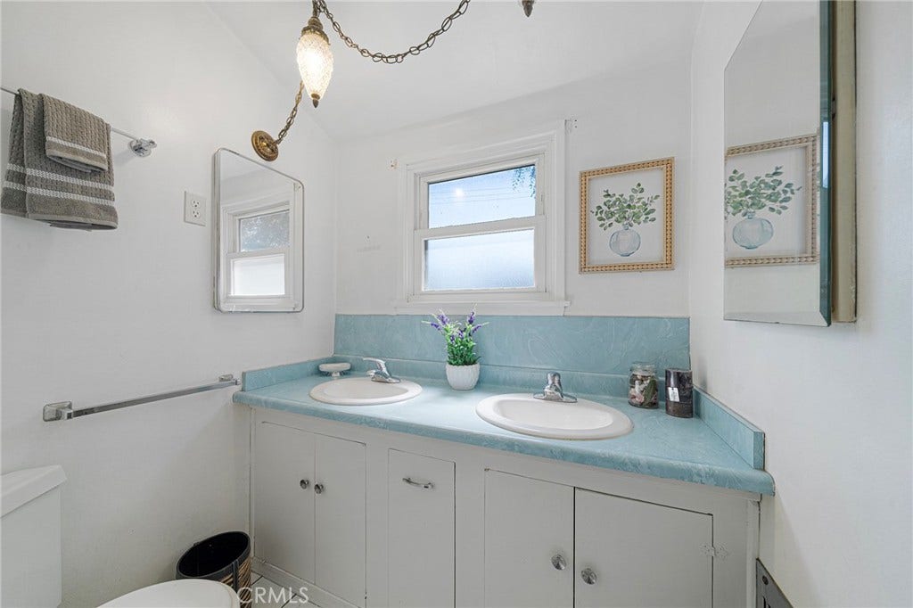 604 N Charter, Covina, CA 91724 Double sink in upstairs bathroom and vintage lighting.