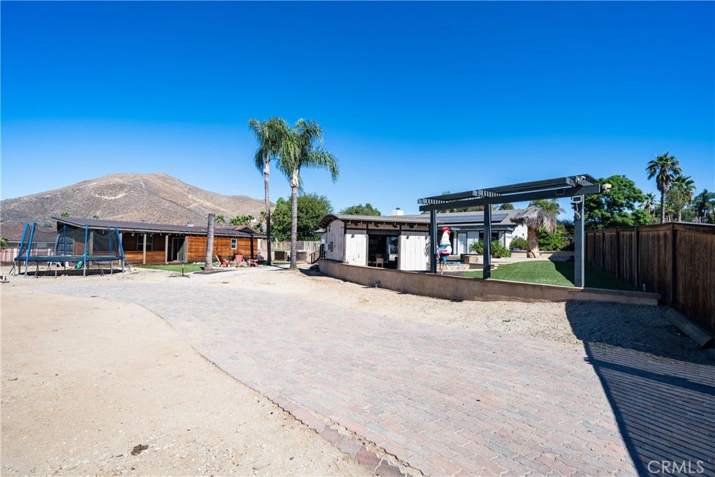6616 Landfair, Riverside, CA 92509 Partially paved driveway with side access to yard.