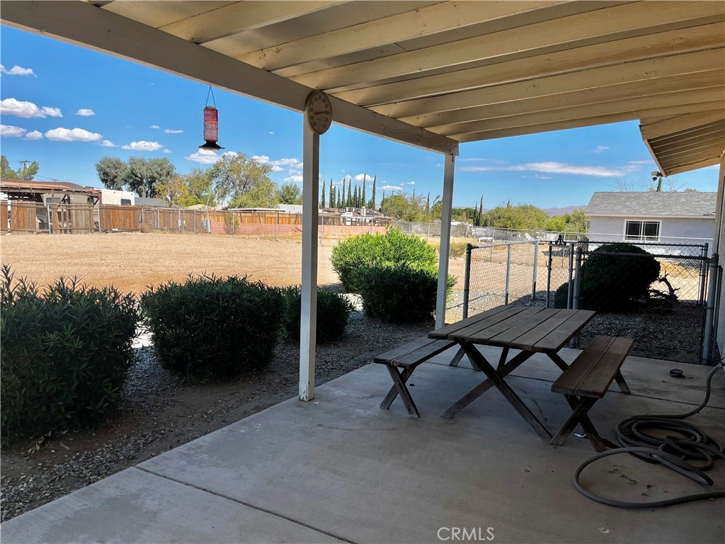 15728 Little Beaver, Victorville, CA 92395 Backyard patio area with small dog run.