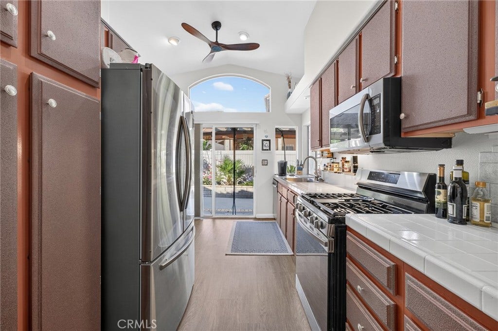 Kitchen has Slider leading to Back Yard