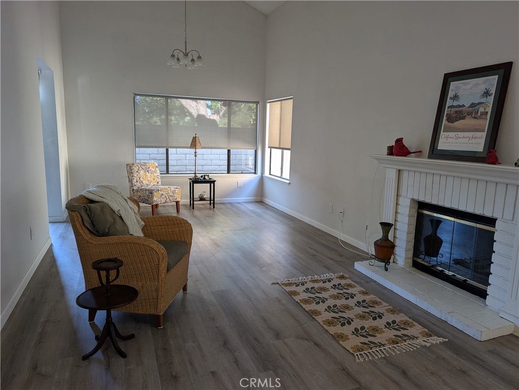 5050 Canyon Crest Drive, Riverside, CA 92507 Cozy fireplace with open concept to dinning area.