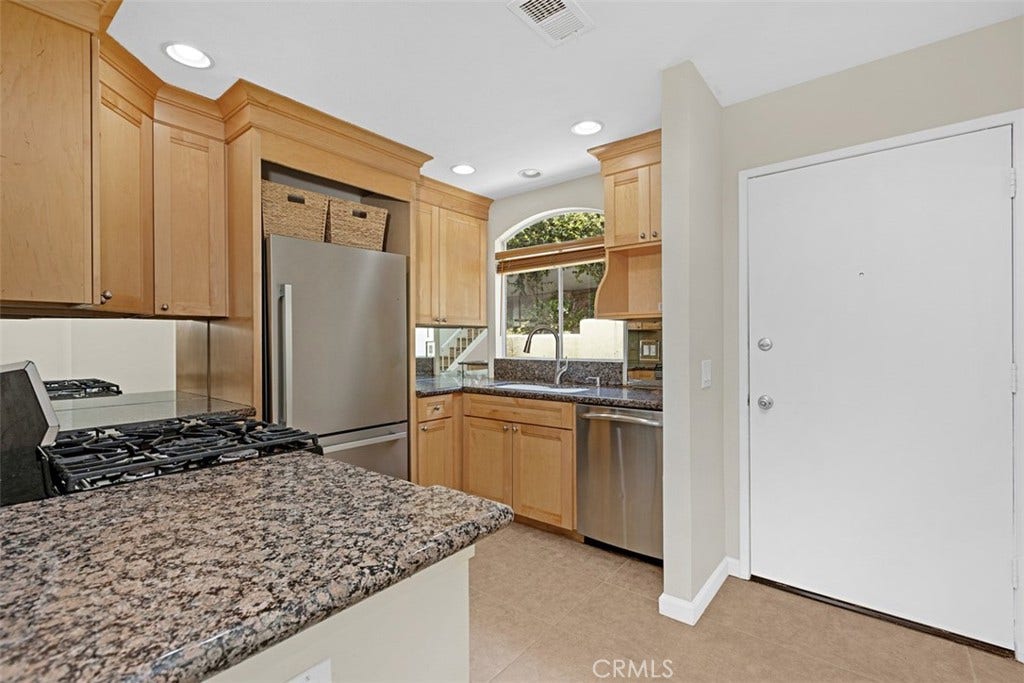 30902 Clubhouse, #23A, Laguna Niguel, CA 92677 Kitchen with granite counter-tops and stainless steel appliances