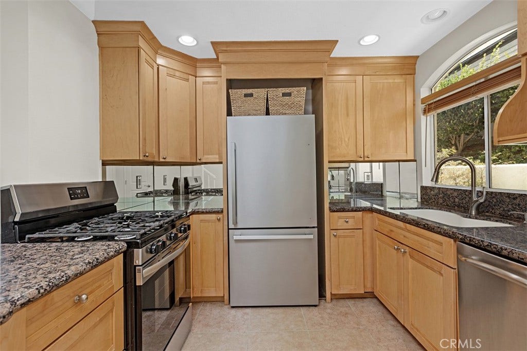 30902 Clubhouse, #23A, Laguna Niguel, CA 92677 Kitchen with granite counter-tops and stainless steel appliances