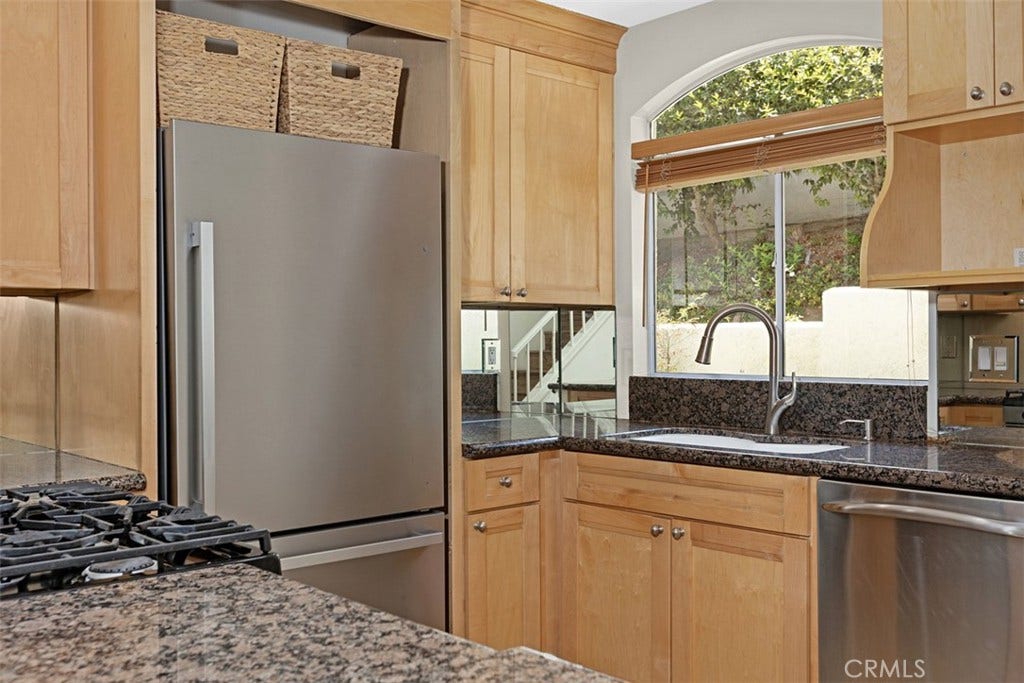 30902 Clubhouse, #23A, Laguna Niguel, CA 92677 Kitchen with granite counter-tops and stainless steel appliances