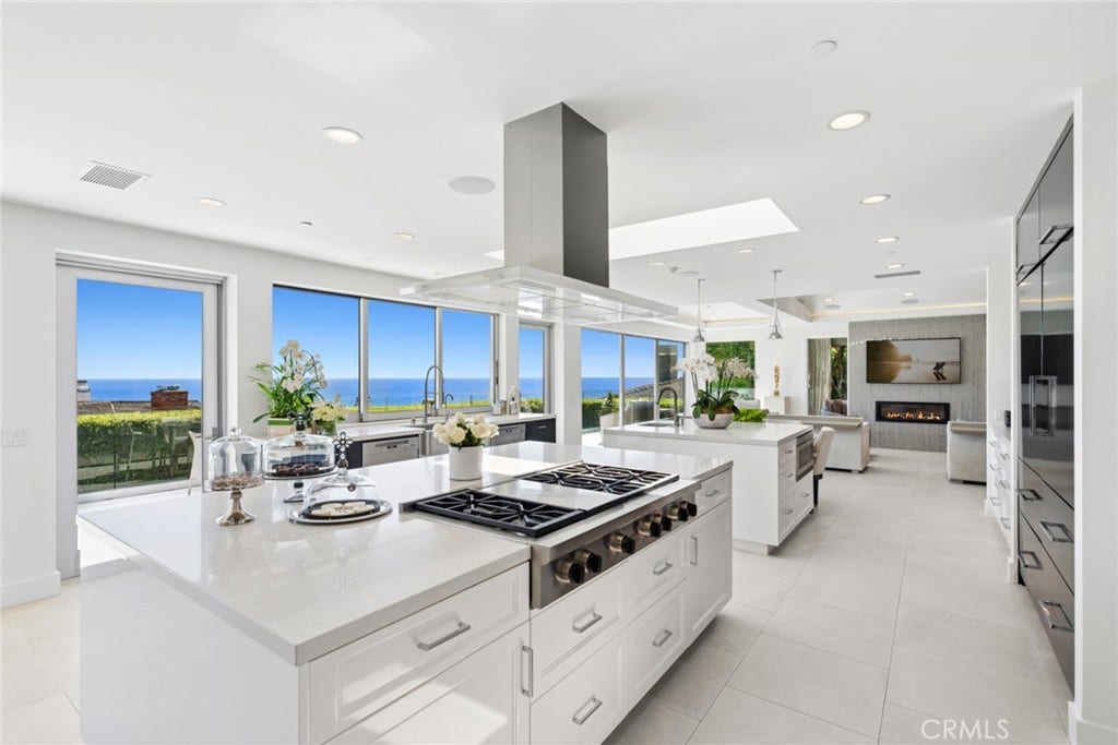 The chefs kitchen is centered around two oversized islands positioned to capture the ocean views and is complemented by a butlers pantry.