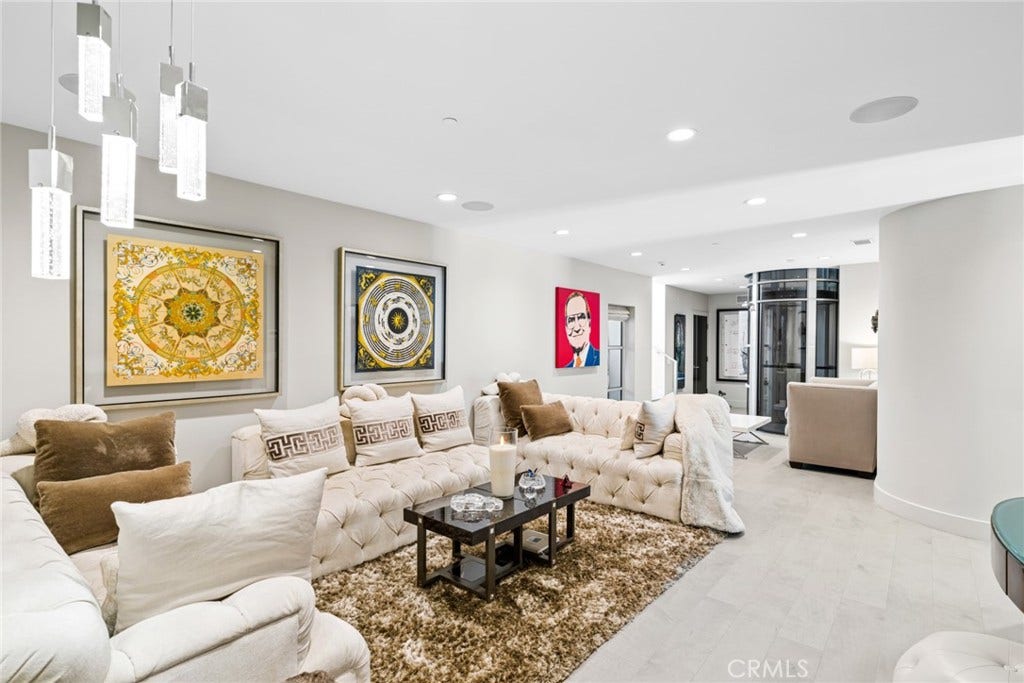 An elevator connects the homes two levels, and an additional living room on the lower level creates a versatile space for entertaining, movie nights or quiet relaxation.