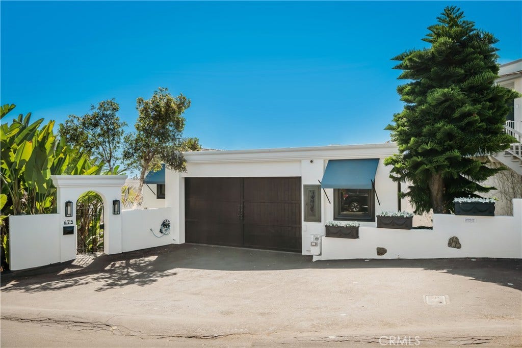 Two car garage with 6 additional parking spaces
