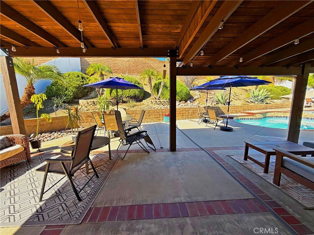 2400 Pepperwood, Corona, CA 92882 Covered patio off the family room creates a seamless connection between the home and its resort-style backyard.