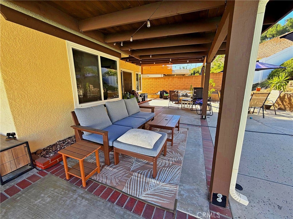 2400 Pepperwood, Corona, CA 92882 Covered outdoor living area conveniently located off the kitchen for easy indoor-outdoor dining and entertaining.