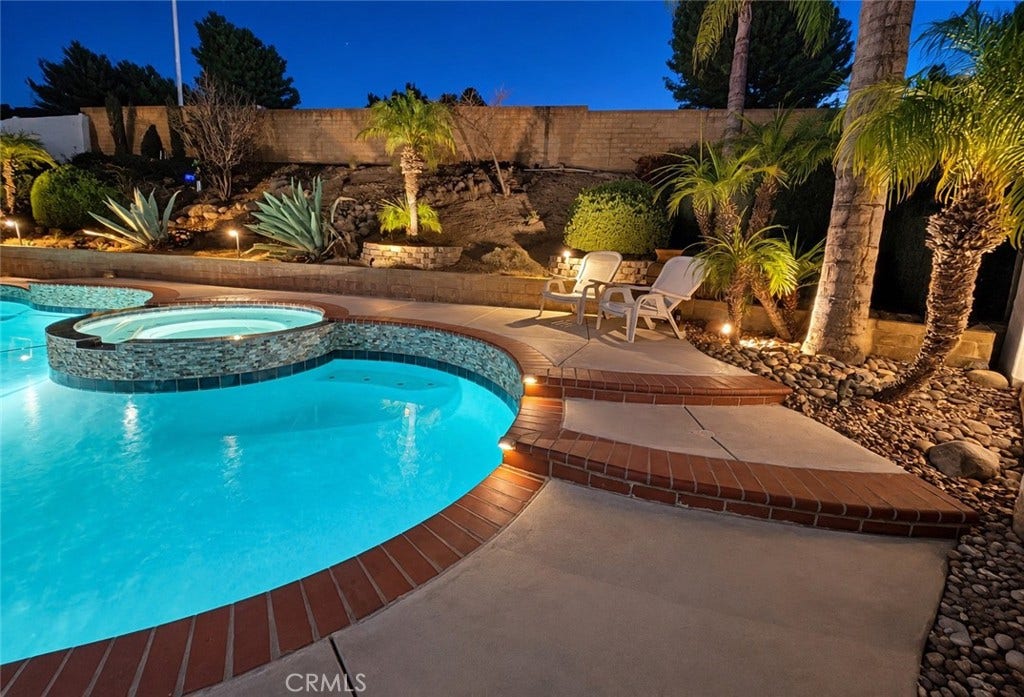 2400 Pepperwood, Corona, CA 92882 Poolside entertaining at its best, with an elevated spa and generous surrounding space for lounging, dining, and relaxing.