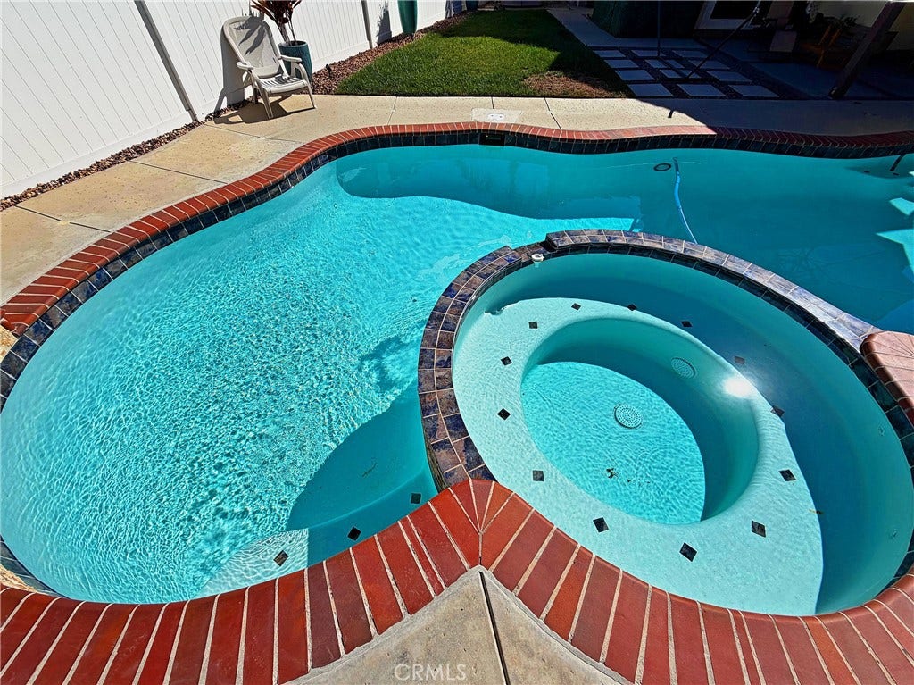 2400 Pepperwood, Corona, CA 92882 Sparkling pool and elevated spa create a beautiful centerpiece for the backyard and outdoor living areas.