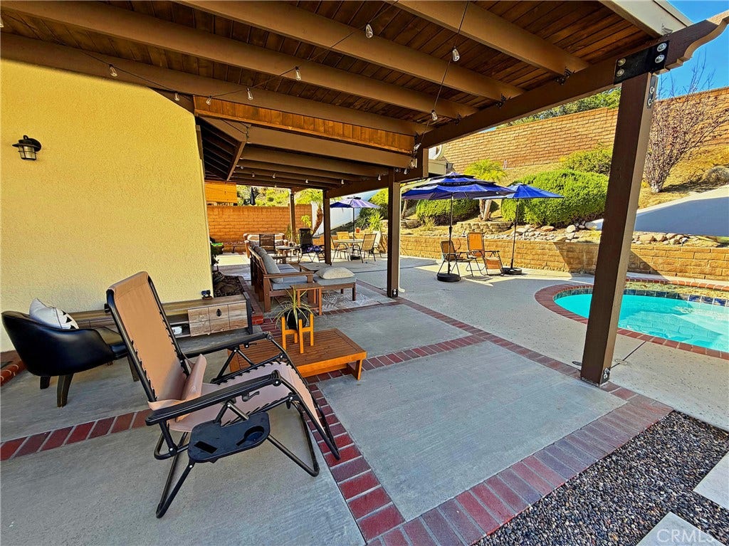 2400 Pepperwood, Corona, CA 92882 Oversized covered patio extends the living space outdoors with plenty of room for dining, entertaining, and relaxing poolside.