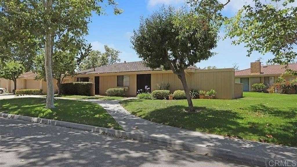 27541 Avenida Larga, San Juan Capistrano, CA 92675 Tree and grass lined sidewalk leads to front yard with easy access into the home.