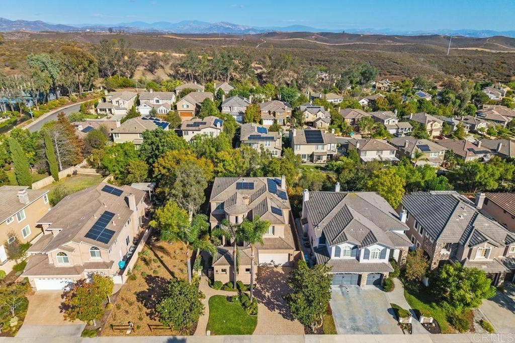12755 Fairbrook Rd, San Diego, CA 92131 Aerial View of the home, open space and back