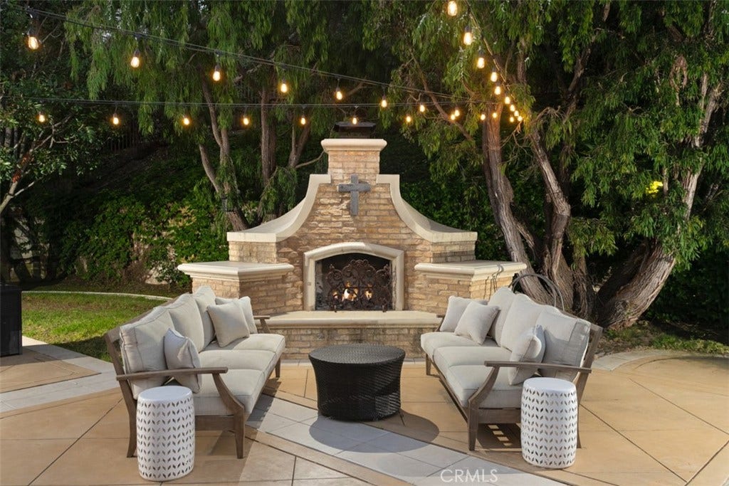 31201 Old San Juan Road, San Juan Capistrano, CA 92675 Great entertaining yard with fireplace and cafe lighting