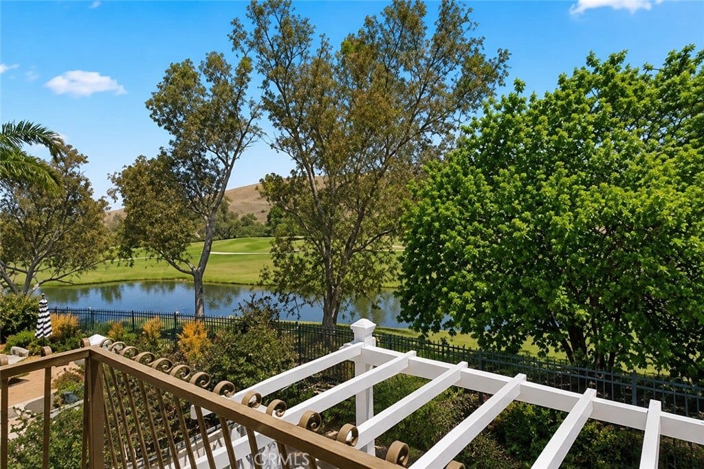 Freshly painted patio cover with view of 15th hole and pond (digitally altered)