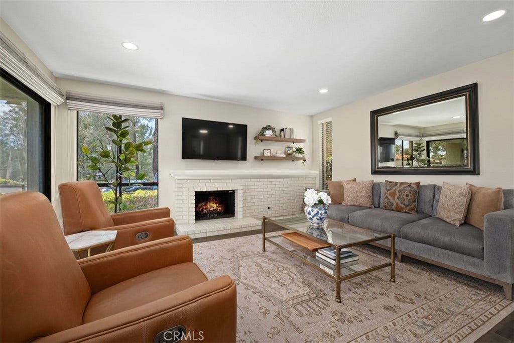 22392 Manacor, #1, Mission Viejo, CA 92692 Virtually staged fire in the fireplace.