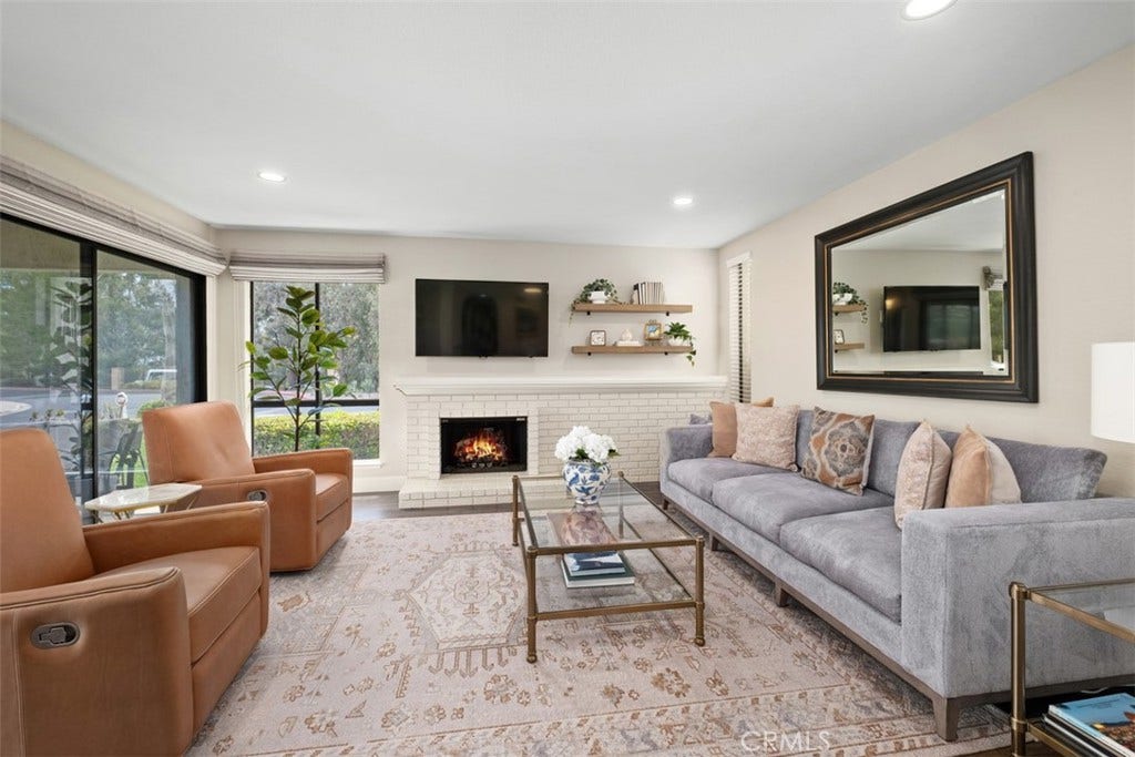22392 Manacor, #1, Mission Viejo, CA 92692 Virtually staged fire in the fireplace.