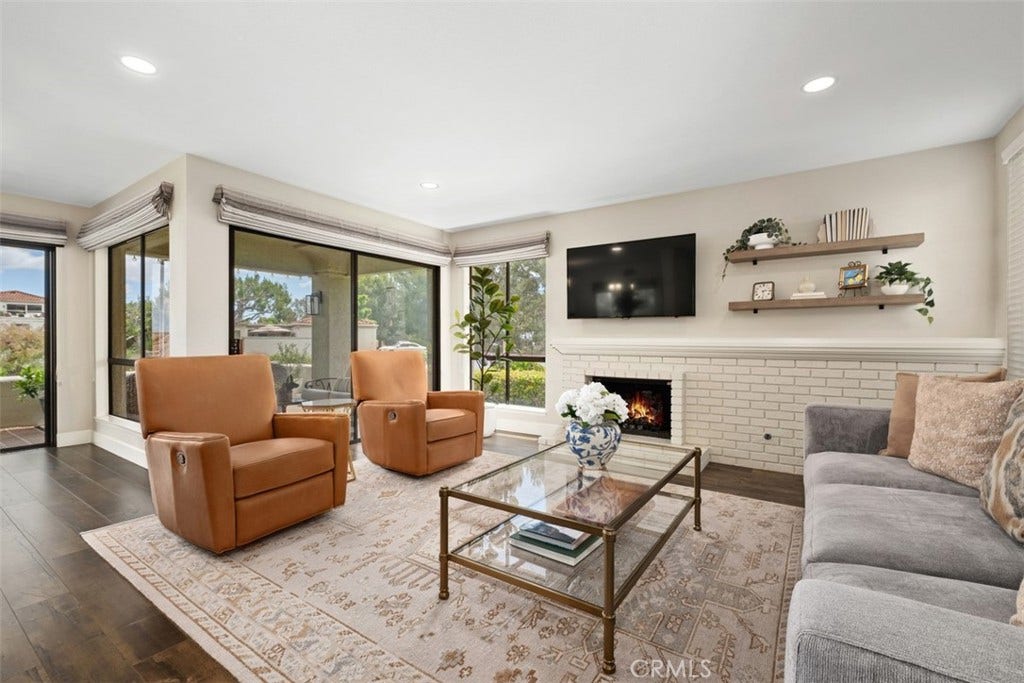22392 Manacor, #1, Mission Viejo, CA 92692 Virtually staged fire in the fireplace.