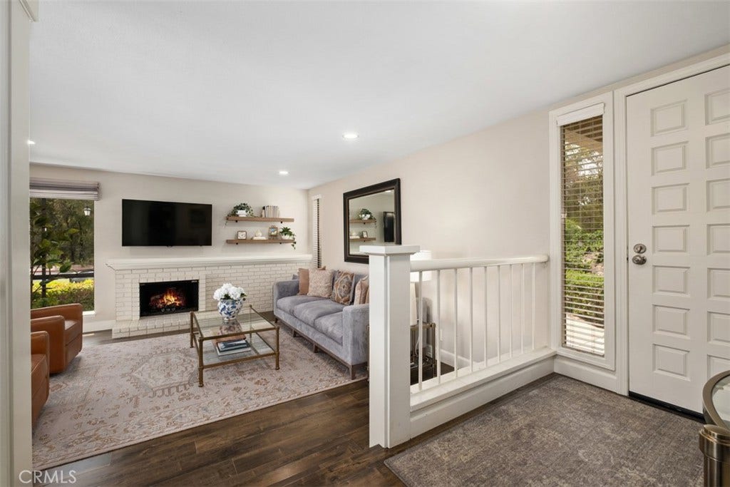 22392 Manacor, #1, Mission Viejo, CA 92692 Virtually staged fire in the fireplace.
