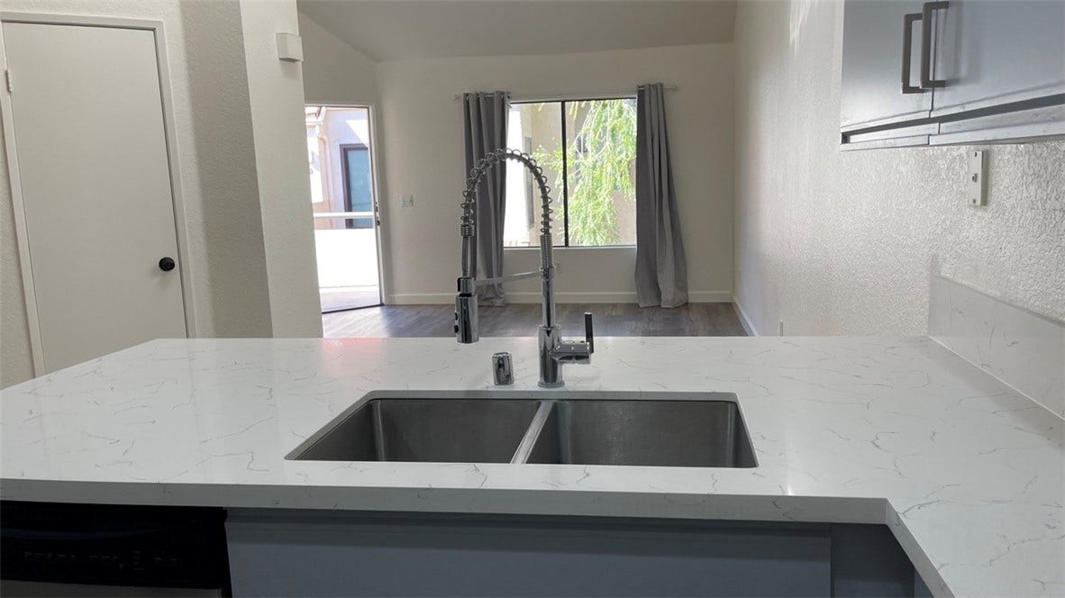 Kitchen looks out to dining area and living room