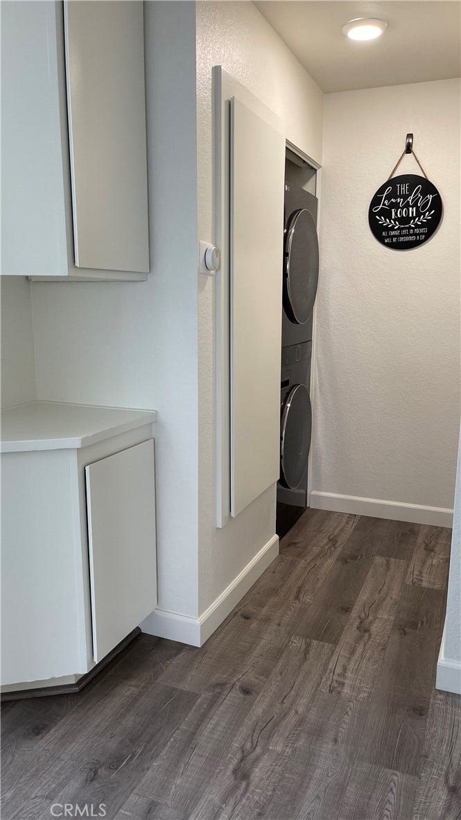Hallway - linen closet and stackable washer/dryer unit