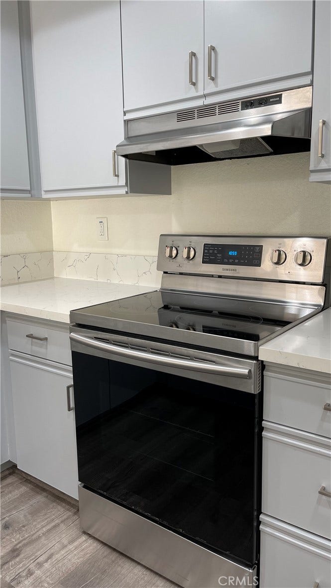 Range with hood above
