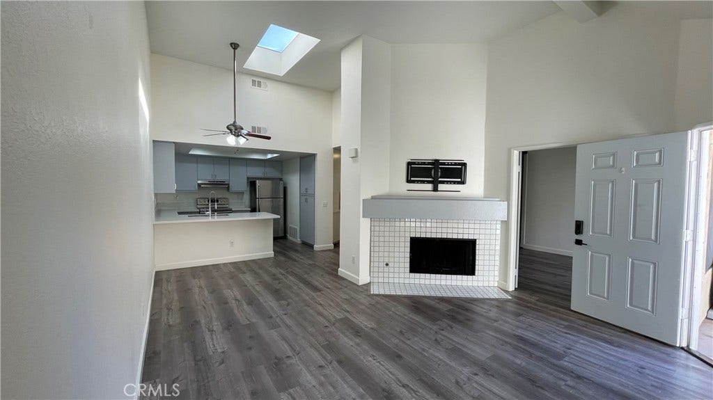 Living Room opens to Dining area, kitchen and to the right is the second bedroom - great for home office, or studio