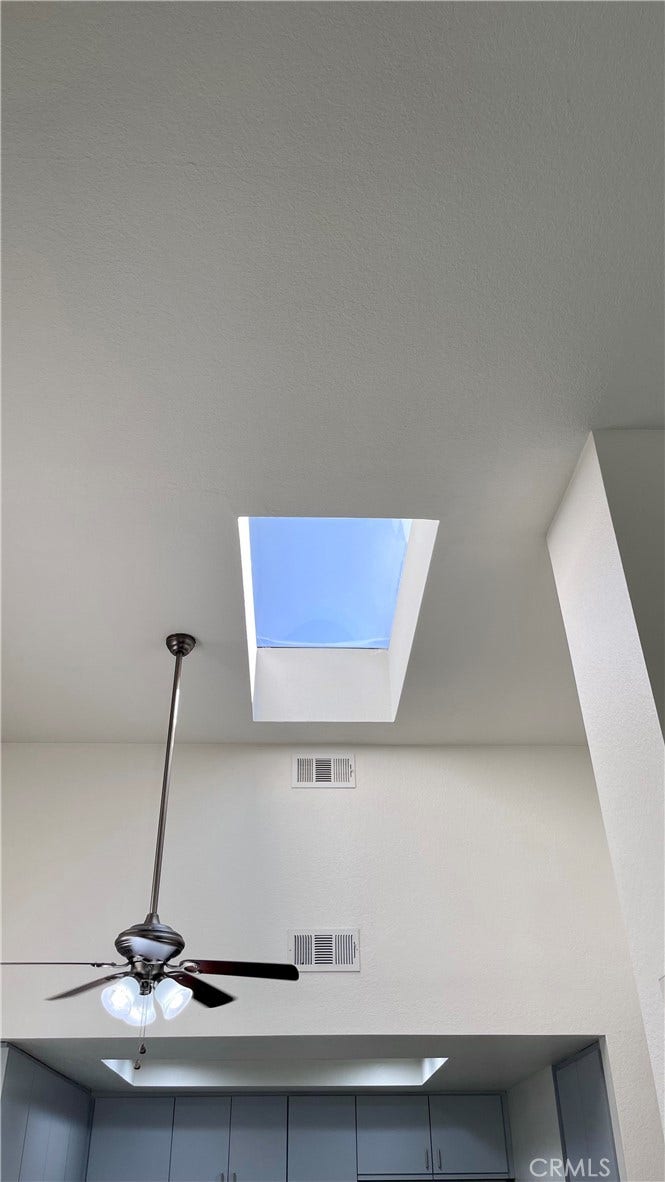 Skylight makes the room light and bright with natural sunlight.