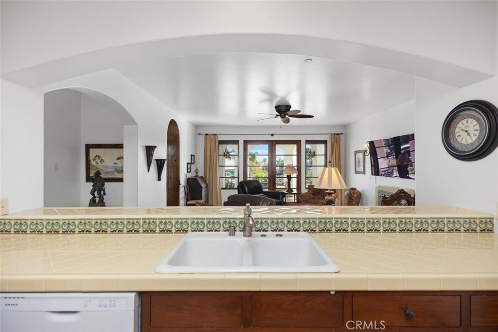 240 Avenida Rosa, #B, San Clemente, CA 92672 Kitchen looking out towards living area and private patio.