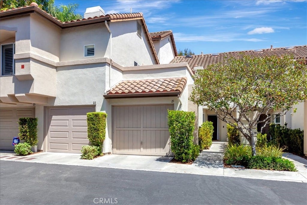 26412 Vicente Lugo, Mission Viejo, CA 92692 Front of home. Private walkway and attached garage. All photos posted are digitally enhanced.