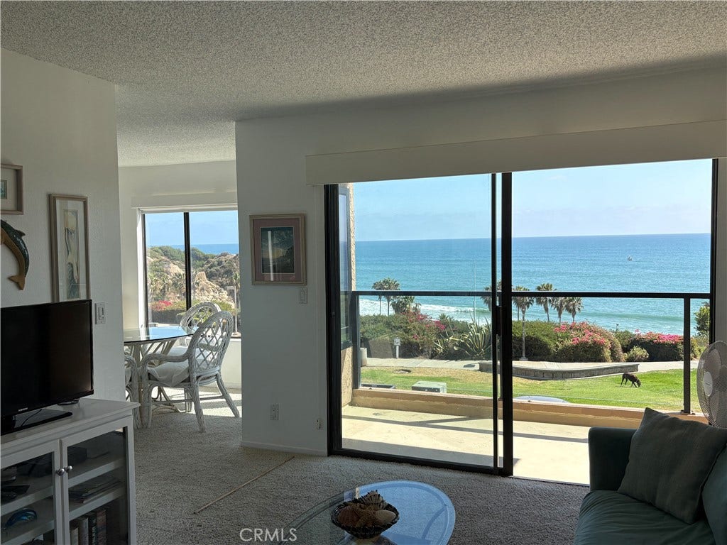 250 Avenida Lobeiro, #E, San Clemente, CA 92672 Large deck framed with glass spans entire width of condo