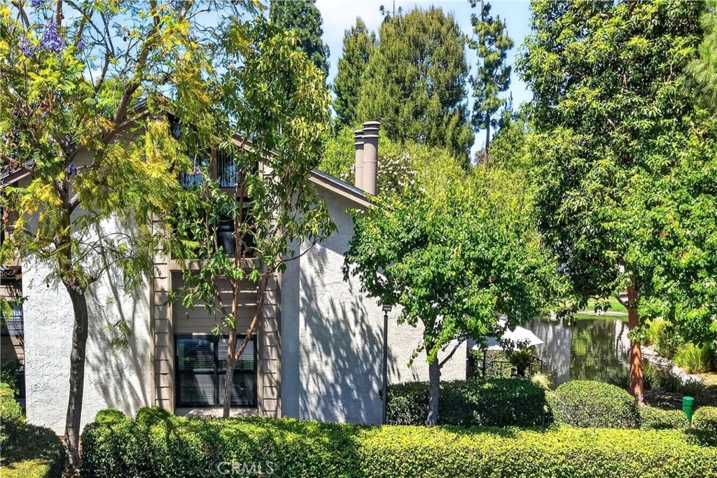 26701 Quail Creek, #100, Laguna Hills, CA 92656 End-unit next to the pond. No one above or below.