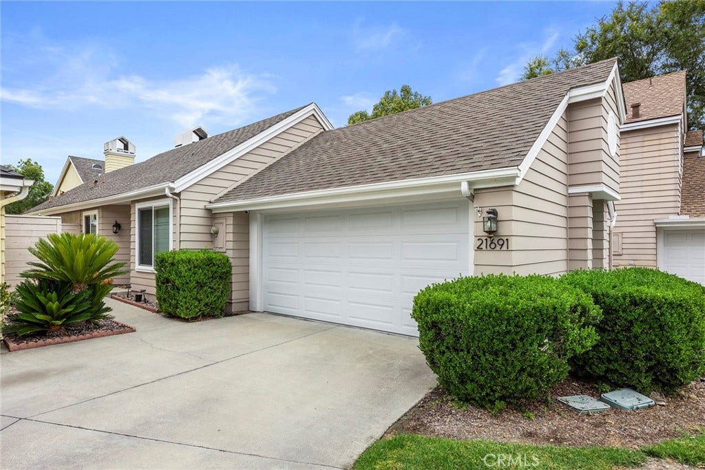 Where else can you find a detached condo with a large driveway?