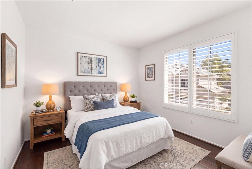 15 Poppyfield, Rancho Santa Margarita, CA 92688 *Virtually Staged* Bright and versatile secondary bedroom with abundant natural light, plantation shutters, and engineered hardwood flooring. An ideal space for guests, family, or a home office.