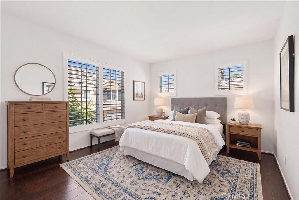 15 Poppyfield, Rancho Santa Margarita, CA 92688 *VIRTUALLY STAGED* Spacious secondary bedroom featuring engineered hardwood flooring, plantation shutters, and abundant natural light.