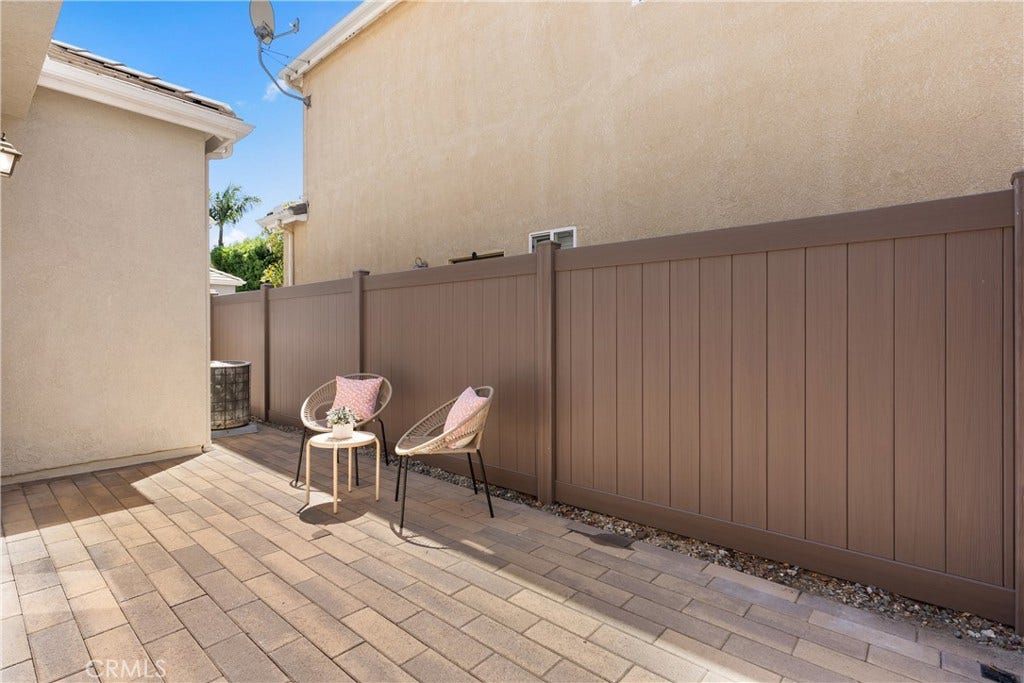 15 Poppyfield, Rancho Santa Margarita, CA 92688 The expansive paver patio provides a versatile outdoor living space with room to lounge, entertain, or personalize to your lifestyle, all with the convenience of low maintenance landscaping.
