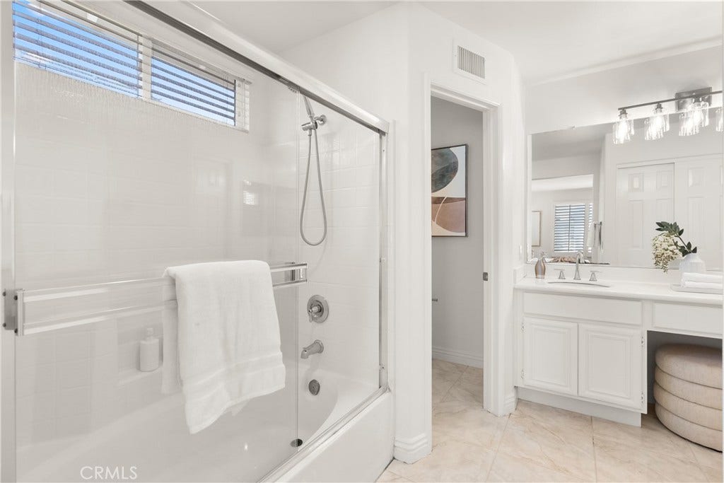 15 Poppyfield, Rancho Santa Margarita, CA 92688 Completing the primary bath is a shower and tub combination, offering the flexibility of a relaxing soak or a quick shower while maintaining a clean, timeless design.