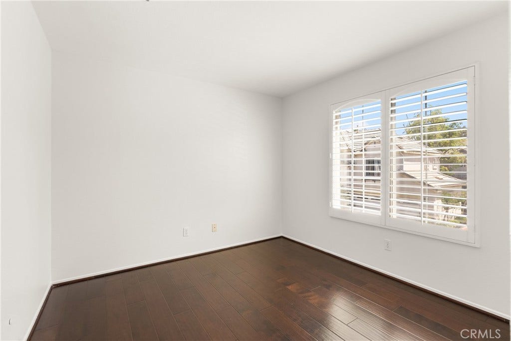 15 Poppyfield, Rancho Santa Margarita, CA 92688 A spacious blank canvas with rich wood flooring and abundant natural light, this versatile bedroom is ready to be customized to fit your lifestyle.
