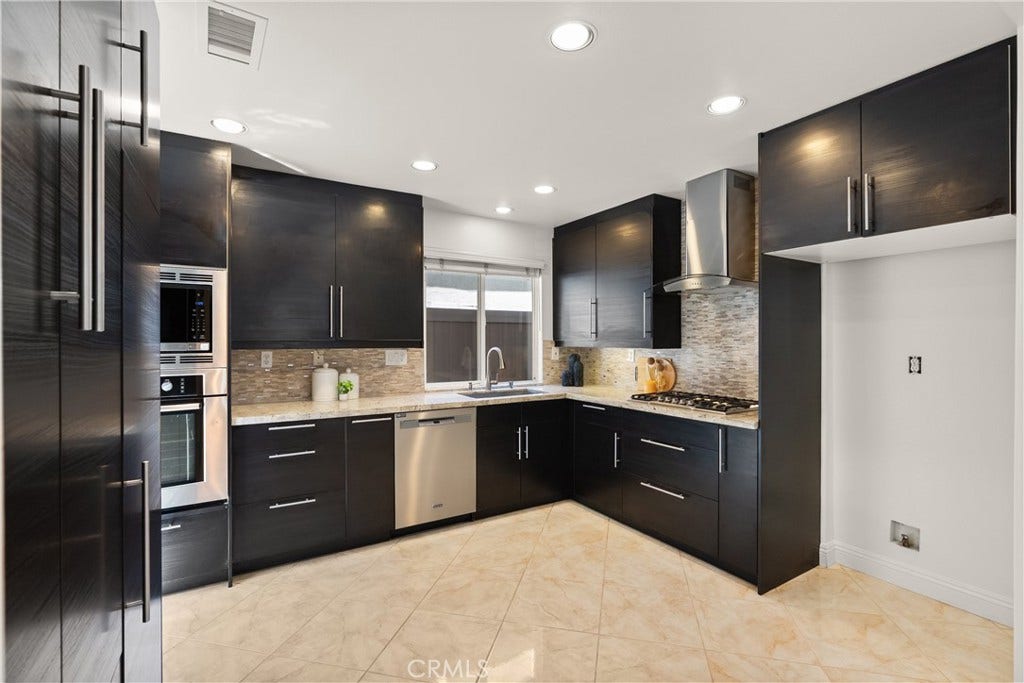15 Poppyfield, Rancho Santa Margarita, CA 92688 Designed for both everyday living and entertaining, the kitchen offers generous prep space, abundant cabinetry, stainless steel appliances, granite countertops, and an open layout that keeps you connected to the home's main living areas.