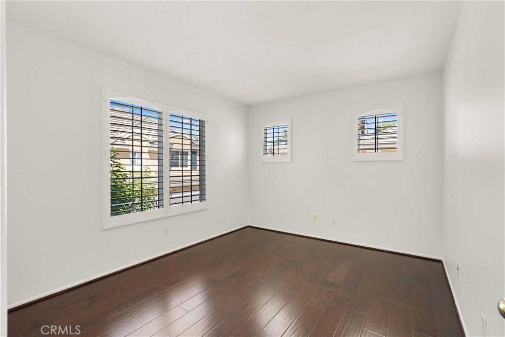 15 Poppyfield, Rancho Santa Margarita, CA 92688 Bright and versatile, this generously sized bedroom features rich wood flooring, plantation shutters, and plenty of space to personalize as a guest room, home office, or children's bedroom.