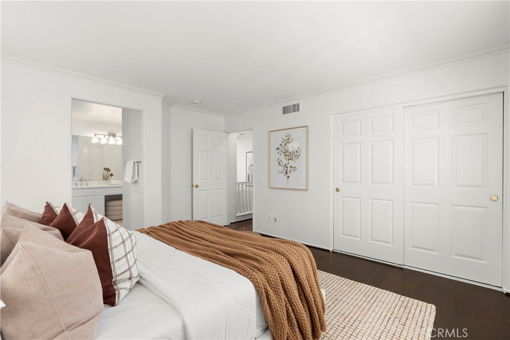 15 Poppyfield, Rancho Santa Margarita, CA 92688 Designed for comfort and functionality, the expansive primary bedroom features generous proportions, dual closets, an en suite bathroom, and a serene atmosphere perfect for unwinding at the end of the day.