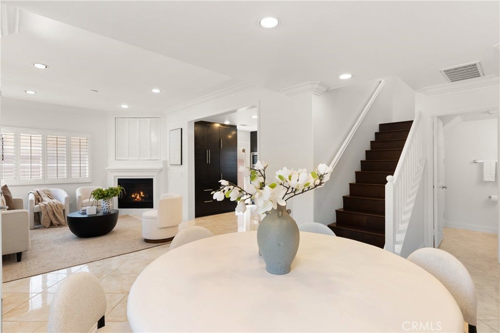 15 Poppyfield, Rancho Santa Margarita, CA 92688 Spacious main level showcasing the effortless transition between the dining area, living room, and staircase, designed for comfortable everyday living and entertaining.